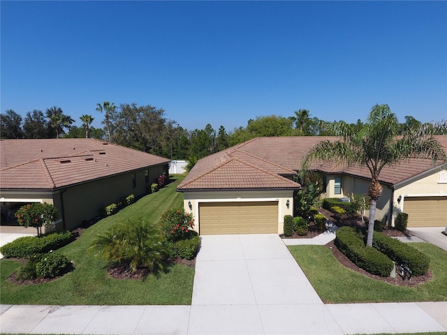 view of front facade with a front yard and a garage