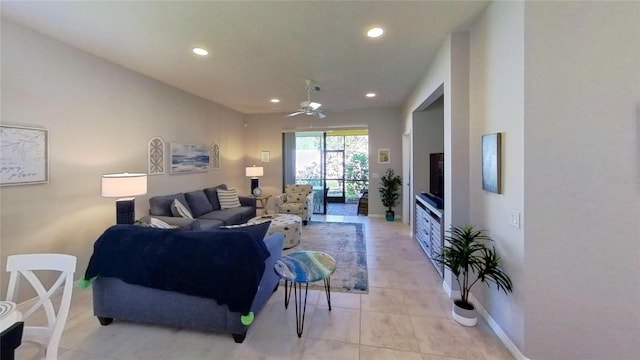 living room featuring light tile flooring and ceiling fan