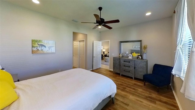 bedroom featuring dark hardwood / wood-style floors and ceiling fan