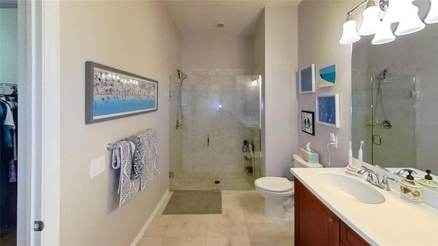 bathroom with walk in shower, tile flooring, oversized vanity, and toilet