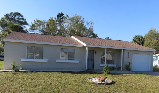 single story home featuring a front lawn and a garage