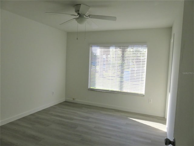 empty room with light hardwood / wood-style floors and ceiling fan