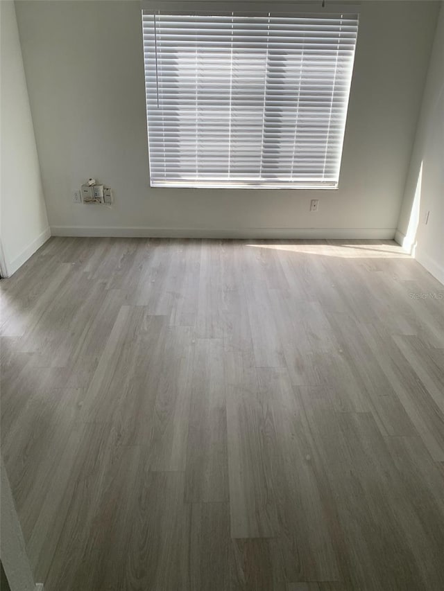 empty room with light hardwood / wood-style floors