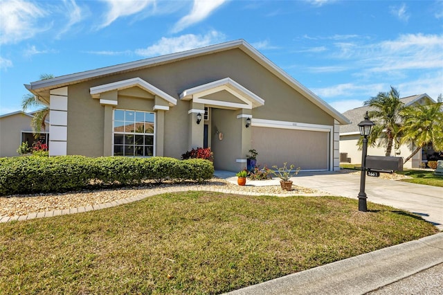 view of front of home featuring a front yard and a garage