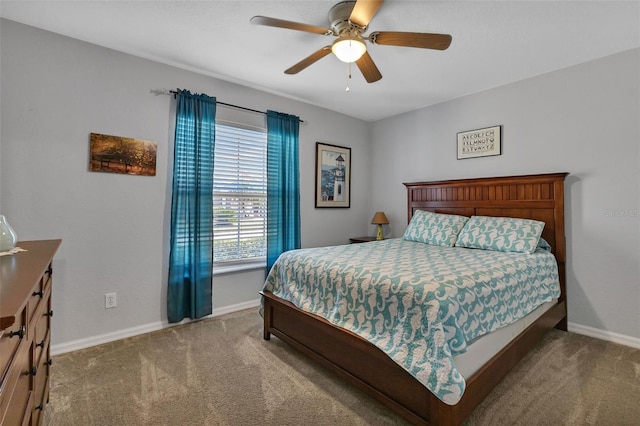 bedroom with ceiling fan and carpet