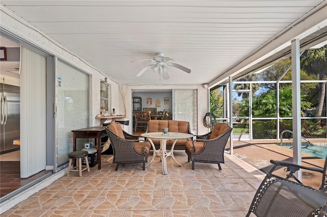 sunroom / solarium with ceiling fan