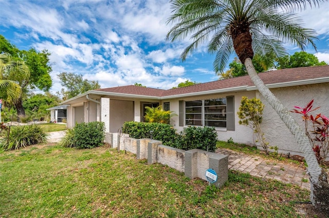 view of property exterior with a yard