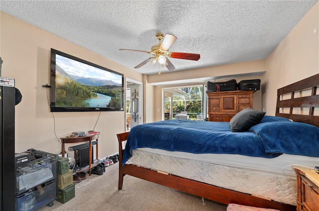 bedroom featuring a textured ceiling, carpet, and ceiling fan