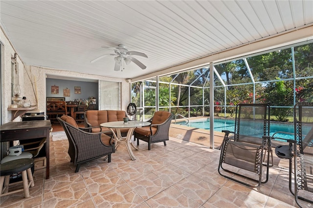 sunroom / solarium with ceiling fan