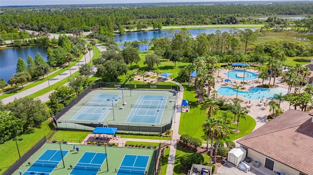 birds eye view of property with a water view