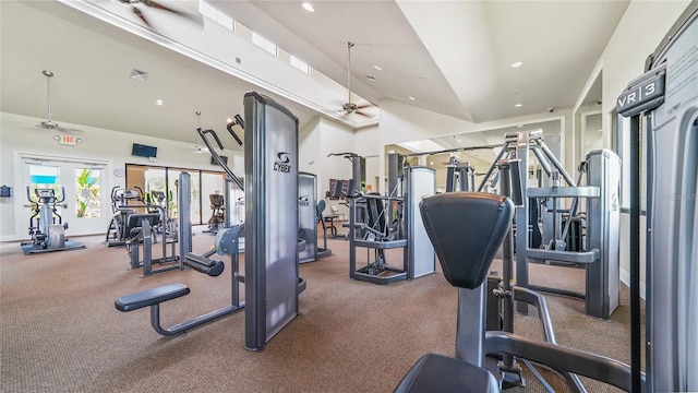 exercise room featuring ceiling fan, lofted ceiling, and french doors