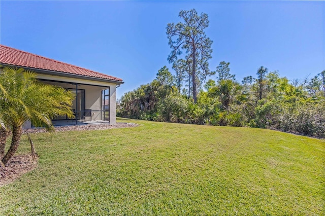 view of yard featuring a sunroom