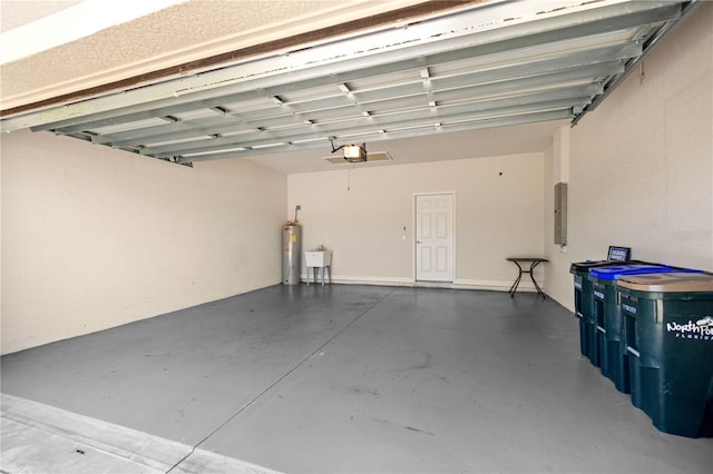 garage with electric water heater, sink, a garage door opener, and electric panel