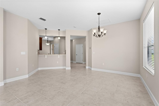 interior space featuring light tile patterned floors and a notable chandelier