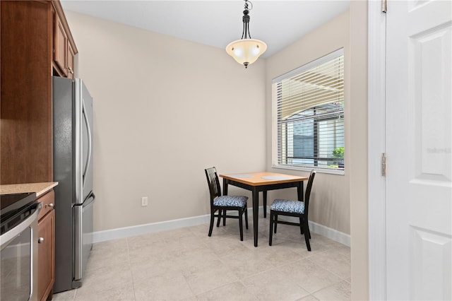 dining space with light tile patterned flooring