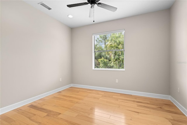 unfurnished room featuring ceiling fan and hardwood / wood-style flooring