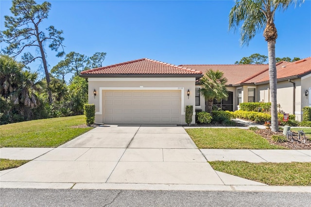 mediterranean / spanish-style house featuring a garage and a front yard