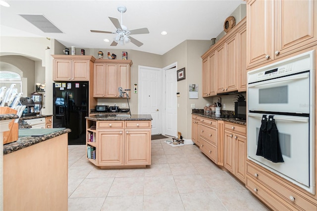 kitchen featuring double oven, black refrigerator with ice dispenser, ceiling fan, and light brown cabinets