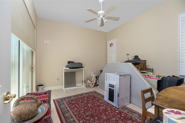 bedroom with light tile flooring and ceiling fan