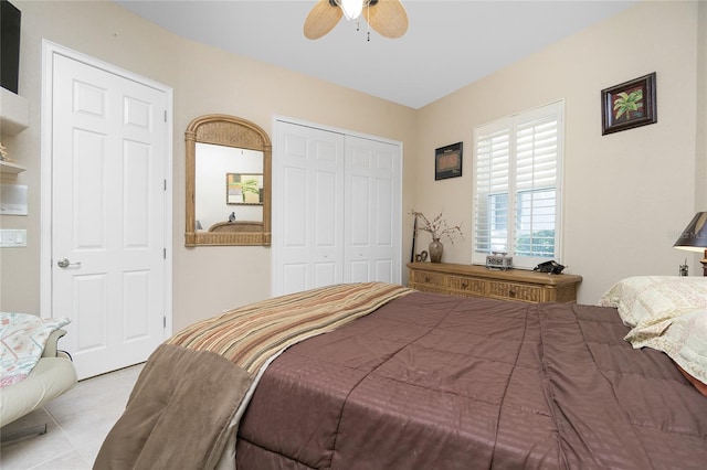 tiled bedroom featuring a closet and ceiling fan