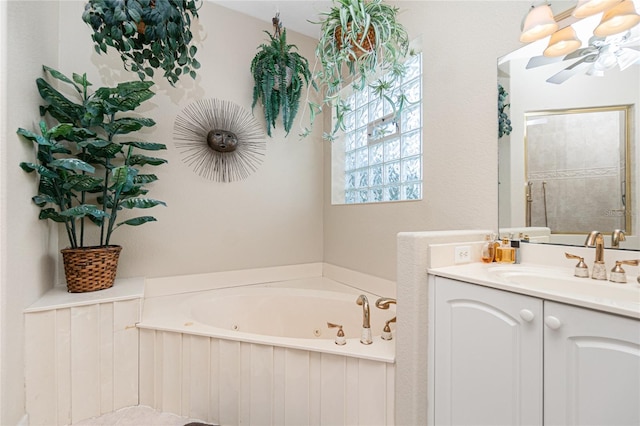 bathroom with vanity and a washtub