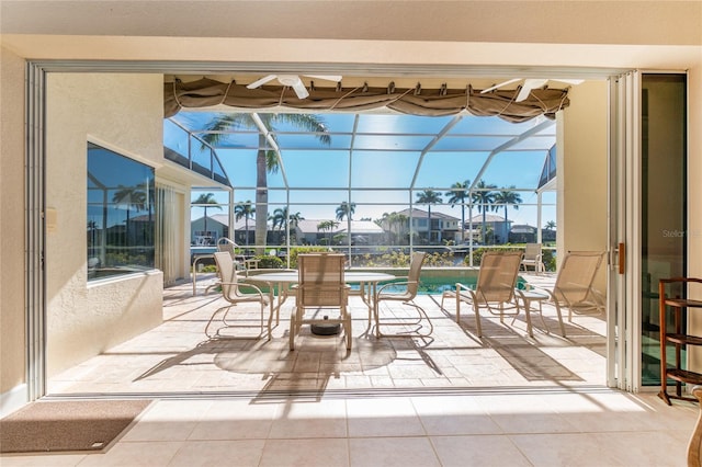 sunroom / solarium featuring a healthy amount of sunlight