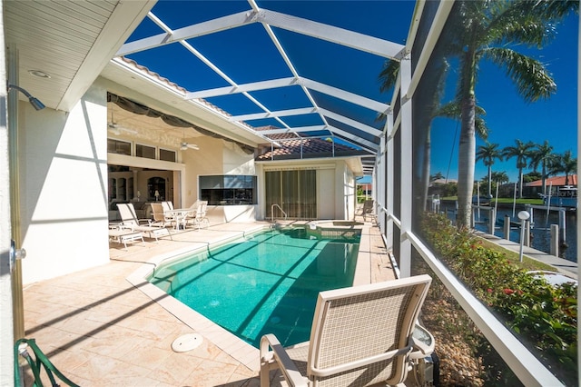 view of pool with a patio area and a lanai