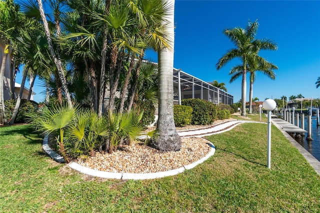 exterior space featuring a dock and a lanai