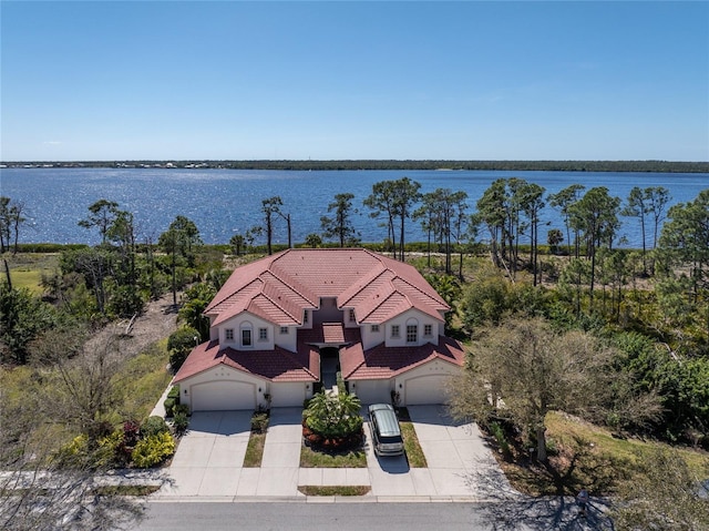 birds eye view of property with a water view