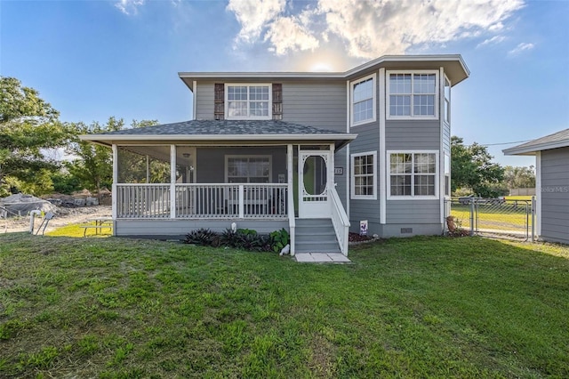 view of front of home featuring covered porch and a front lawn