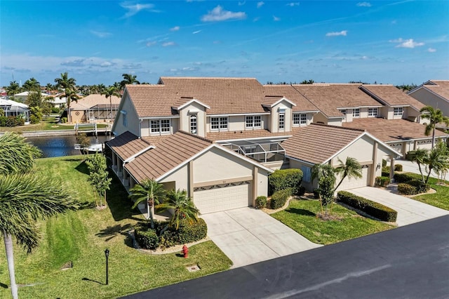 townhome / multi-family property featuring a garage and a front yard