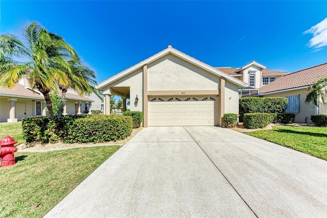 ranch-style home with a garage and a front yard