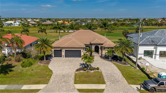 view of front of house featuring a front yard and a garage