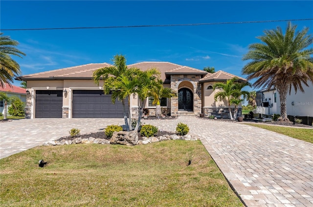 view of front facade featuring a front lawn and a garage