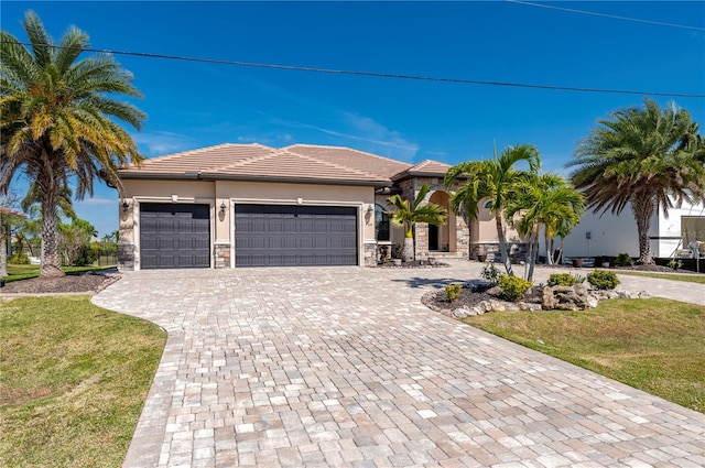 view of front facade featuring a front yard and a garage