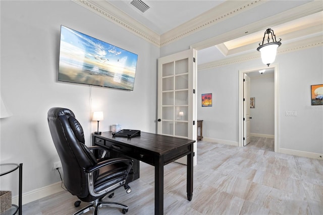 office space featuring a tray ceiling and ornamental molding