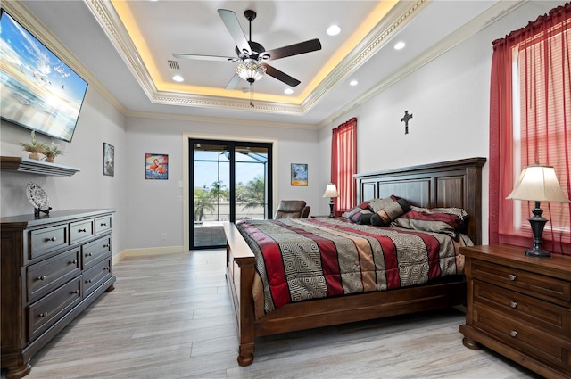 bedroom featuring ceiling fan, light hardwood / wood-style flooring, access to outside, a raised ceiling, and ornamental molding