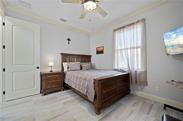 tiled bedroom with ornamental molding and ceiling fan