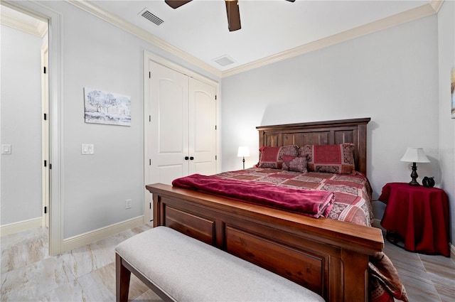 bedroom with a closet, ornamental molding, and ceiling fan