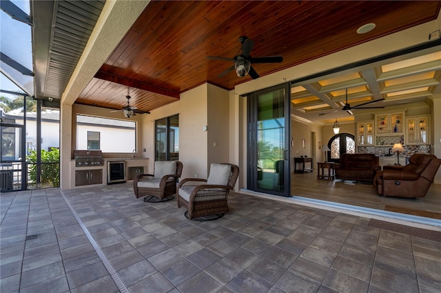 view of terrace with outdoor lounge area, area for grilling, and ceiling fan