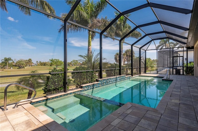 view of swimming pool featuring a patio and a lanai