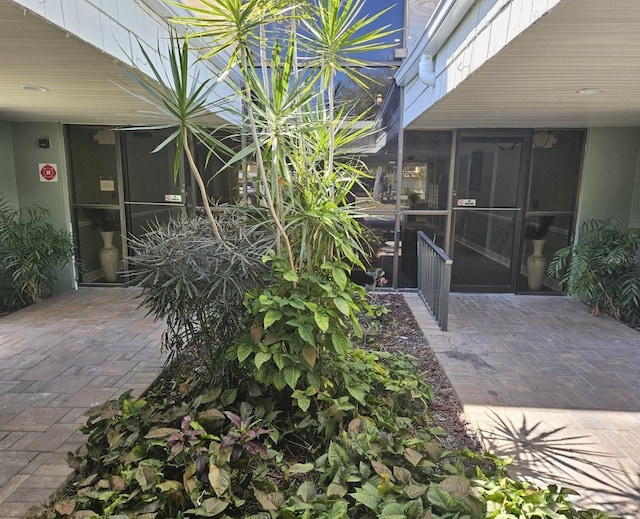 view of patio with a sunroom