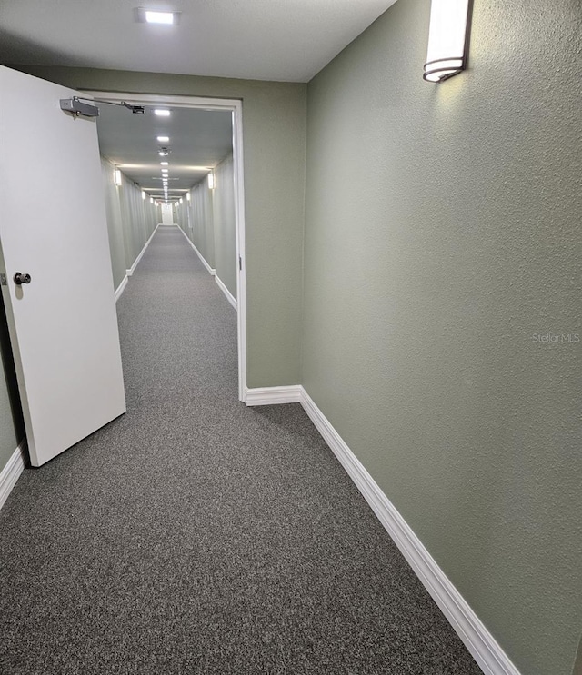21280 Brinson Ave Unit 205, Port Charlotte, FL 33952 - hallway with baseboards, carpet flooring, and a textured wall
