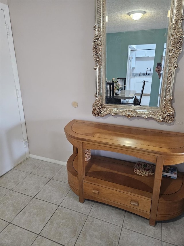 21280 Brinson Ave Unit 205, Port Charlotte, FL 33952 - bathroom with tile patterned floors, baseboards, and a textured ceiling