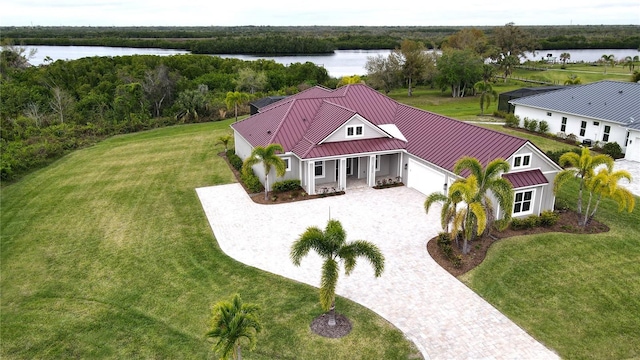 birds eye view of property with a water view