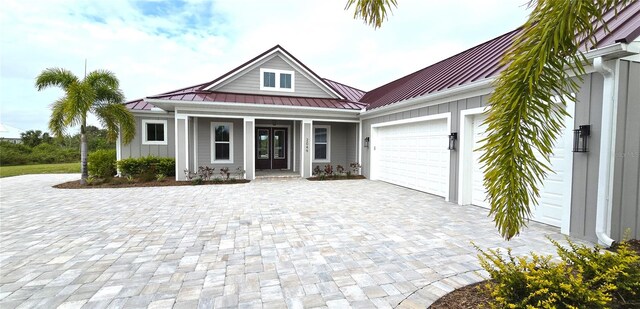 view of front facade featuring a porch and a garage