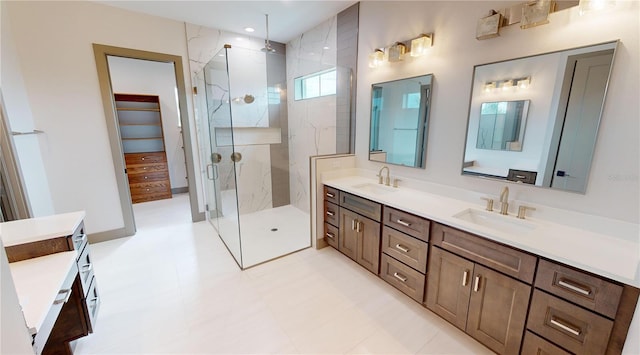 bathroom with vanity, tile flooring, and a shower with shower door