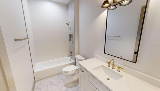 full bathroom featuring vanity, toilet, tile floors, and tiled shower / bath