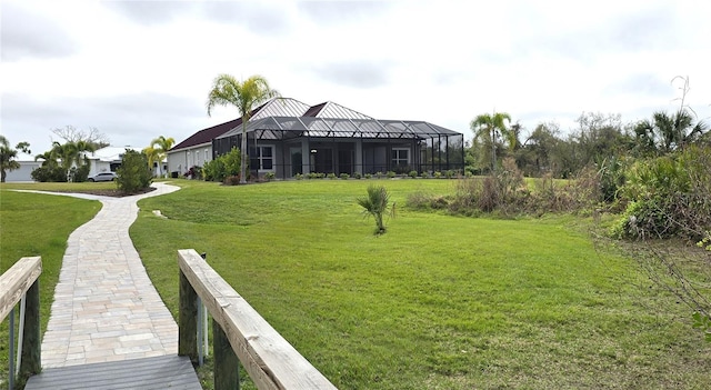 view of yard featuring glass enclosure