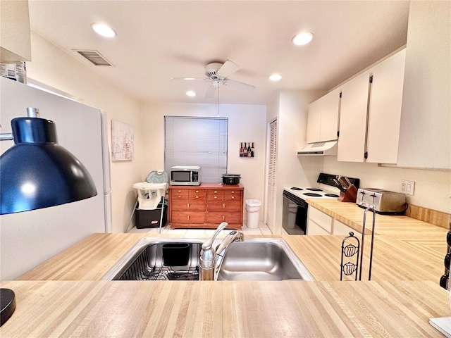 kitchen featuring white cabinets, ceiling fan, electric stove, and sink